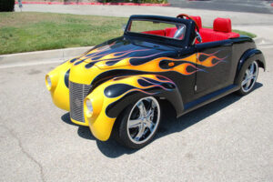 Black 39 Roadster with Yellow Flames affordable golf cart rental, golf cart rent cabo san lucas
