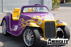 Purple California Roadster with Yellow Flames affordable golf cart rental, golf cart rent cabo san lucas