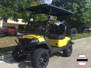 Yellow Aluma 4 Passenger Lifted Golf Cart affordable golf cart rental, golf cart rent cabo san lucas